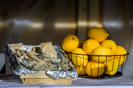 Fresh oysters displayed at a festive market stall at the charming traditional Christmas Market in Zurich, Switzerlandの写真素材