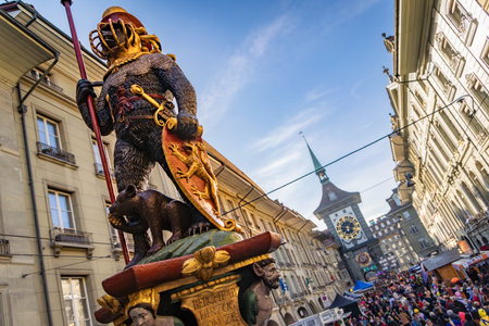 Zahringerbrunnen fountain and crowds celebrating the winter Fasnacht carnival the historic Altstadt...