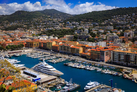 View of boats in the marina and waterfront buildings in Nice port on the Mediterranean Sea, Cote d'Azur, Franceの写真素材