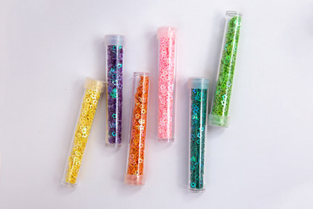 Colorful stars glitter in glass bottlesの写真素材