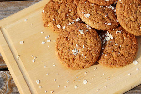 Oatmeal cookies on a wooden backgroundの写真素材