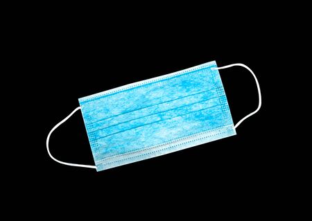Isolated medical mask on a black background