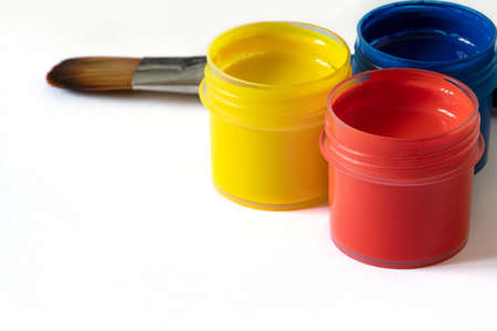 Acrylic paints in jars on a white background. Copy spaceの写真素材