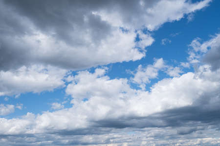 Blue sky background with white clouds close-up. Daylight of the sky. Natural composition of the sky....