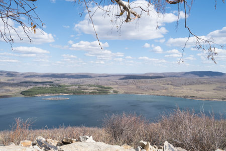 Beautiful sunny day at the top of the mountain. A wonderful view from the mountain to the lake with...