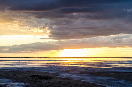 Evening sunset on the Salt lake, clouds and calm water, beautiful landscape, reflection in the waterの写真素材
