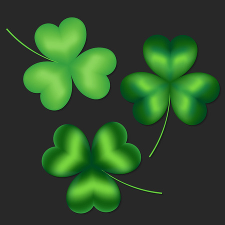 Set of green clover leaves on a dark backgroundのイラスト素材