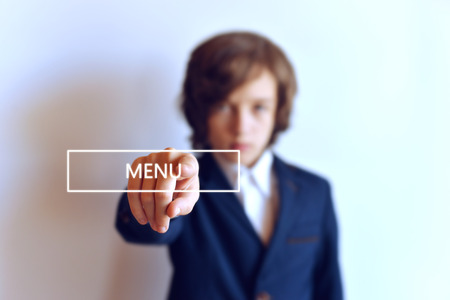 The young man presses the menu button. Hand and button menu.の写真素材