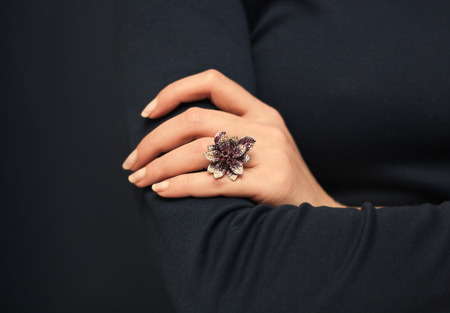 Ring in shape of  flower on woman's handの写真素材