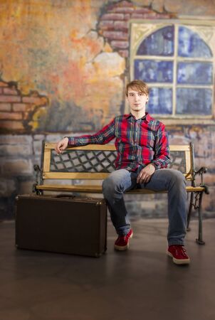 Portrait of handsome white guy waiting somebodyの写真素材