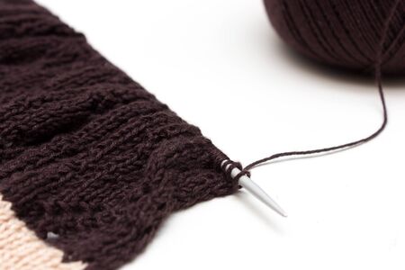 Hand knitted cloth by spokes on neutral backgroundの写真素材