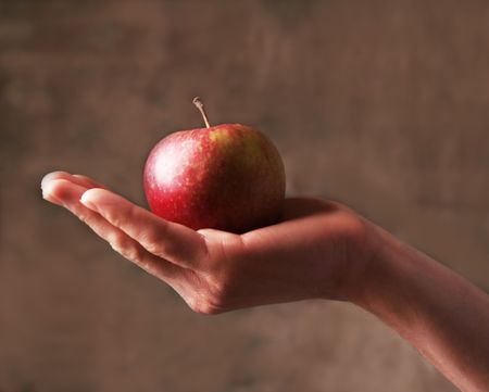 Apple in man`s hand.の写真素材