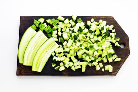 Fresh cucumber. Sliced on a board. View from above.の写真素材