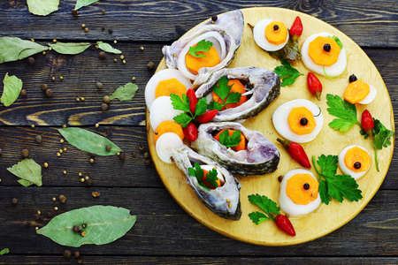 Marinated fish on a wooden background. View from above.の写真素材
