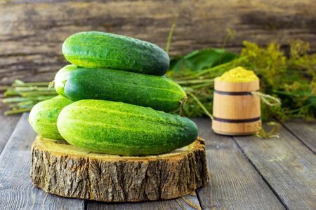 Fresh cucumbers on a wooden background. Summer. Harvesting.の写真素材