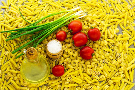 Pasta and tomatoes. Background. View from above.の写真素材