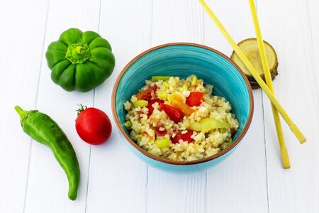 Rice with vegetables in Chinese. White background. View from above.の写真素材