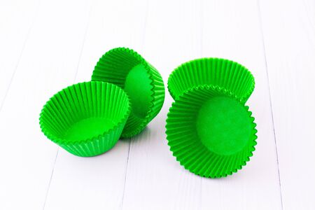 Paper molds for cupcakes. White background.の写真素材