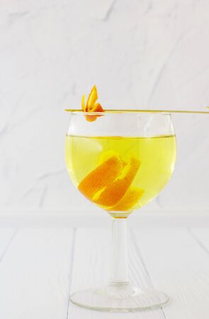 Orange vodka. White background.の写真素材