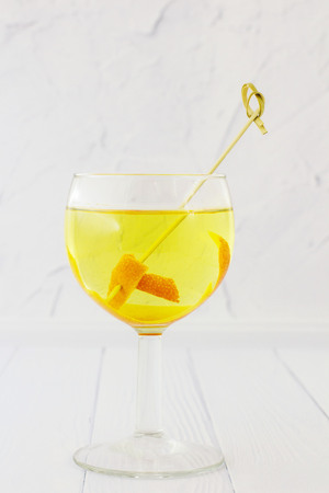 Orange vodka. White background.の写真素材
