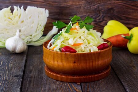 Sour cabbage. Wooden background.の写真素材
