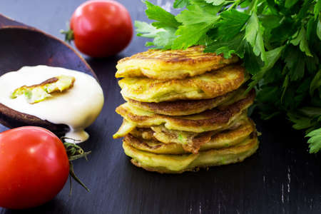 Pancakes from the zucchini. Black background.の写真素材