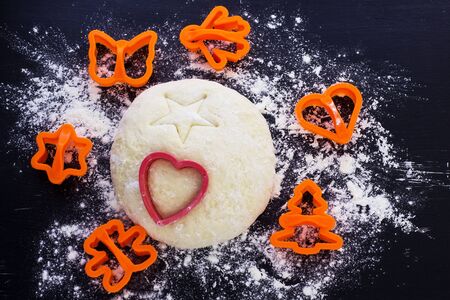 The dough is homemade. View from above. Black background.の写真素材