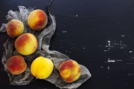 Peaches. Black background. View from above.の写真素材