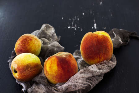 Peaches on a black background.の写真素材