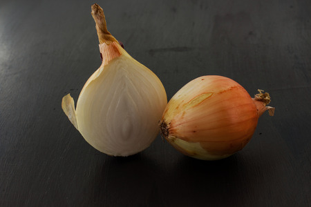 Bulb onions. Black backgroundの写真素材