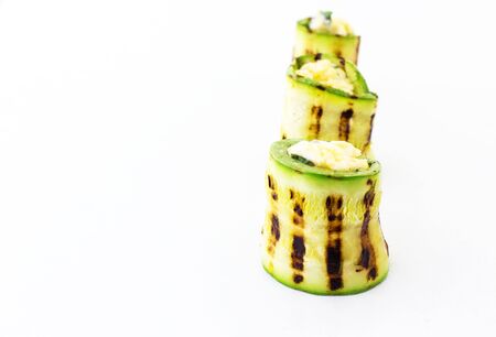 Rolls of courgettes on a white background.の写真素材