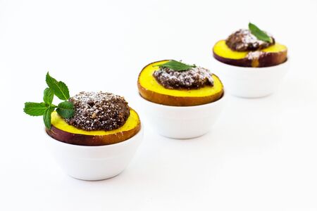 Peaches are baked. Dessert. White background.の写真素材