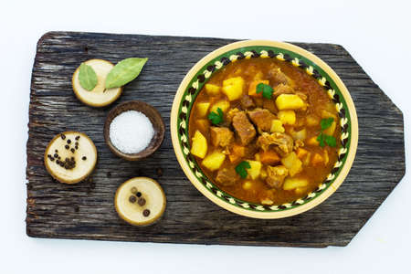 Hungarian soup goulash on a wooden board.の写真素材