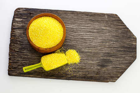 Corn cereals on a wooden board.の写真素材