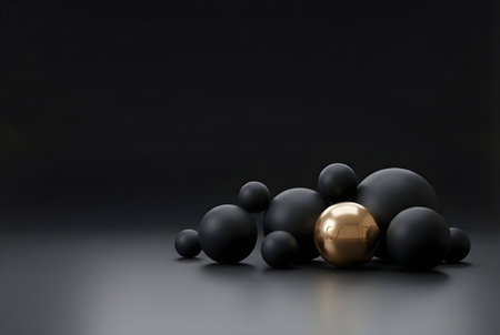 Minimal 3D scene with matte black spheres and a glossy gold ball embossed SALE, dark background with copy space; modern luxury concept for retail promotion.の素材
