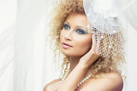 Closeup portrait of beautiful blond girl wearing bridal accessoriesの写真素材