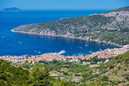 Beautiful view on harbor of mediterrian sea with old town and lots of boats. Vis, Komiza, Croatiaの写真素材