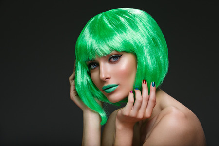 Beautiful girl in green wigの写真素材