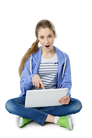 Teen age girl with tabletの写真素材
