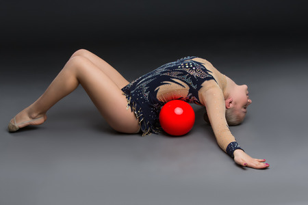Gymnastist girl with red ballの写真素材