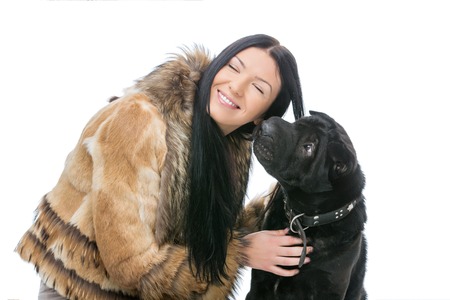 Girl with black shar pei dogの写真素材