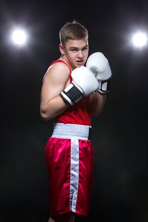 Young boxer in red formの写真素材