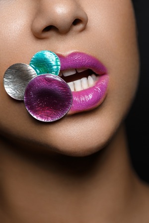closeup shot of full sexy woman lips with bright pink lipstick. copyspace.