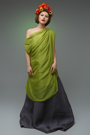 girl in long dress with flowers on headの写真素材
