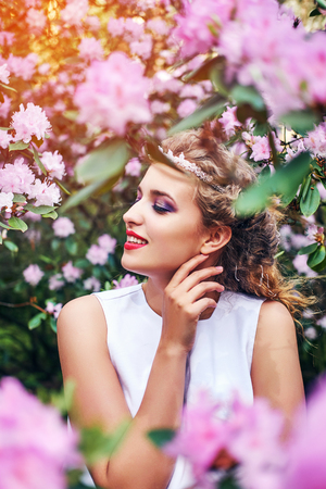 girl in dress in rhododendron gardenの写真素材