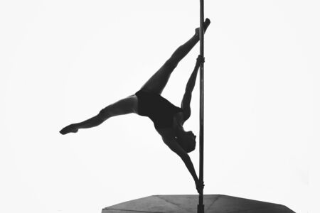 beautiful pole dancer girl silhouetteの写真素材