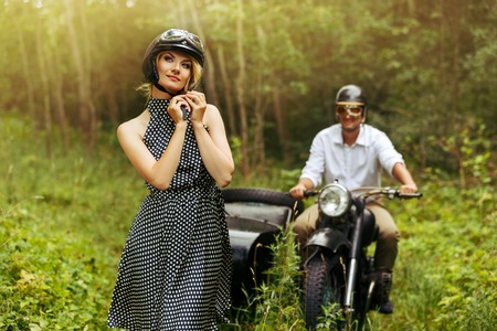 beautiful couple on retro motorbikeの写真素材
