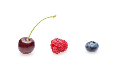 blueberry, cherry and raspberry berries isolated on white backgroundの写真素材