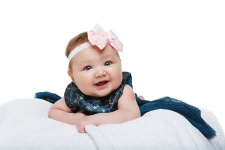 happy beautiful baby girl with bow headbandの写真素材
