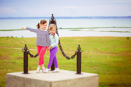little girls standing on the background of the future bridge between Crimea and Russiaの写真素材
